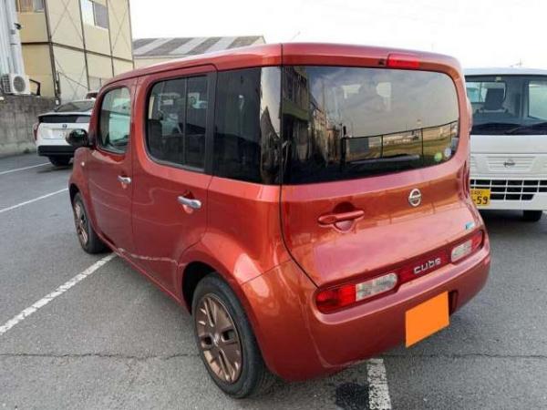 Nissan Cube 2015 оранжевый сзади
